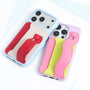 Angled top view of two stitched colorblock phone cases with integrated card pockets and raised camera surrounds.