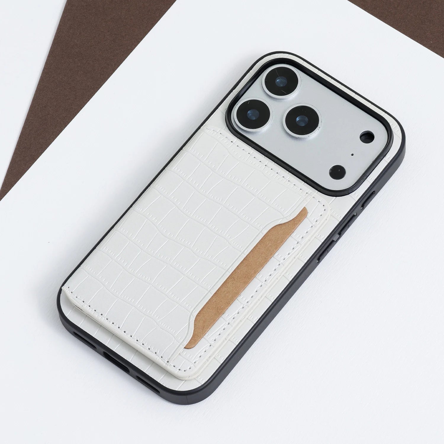 White croco card pocket phone case displayed beside a black and green version for color comparison.