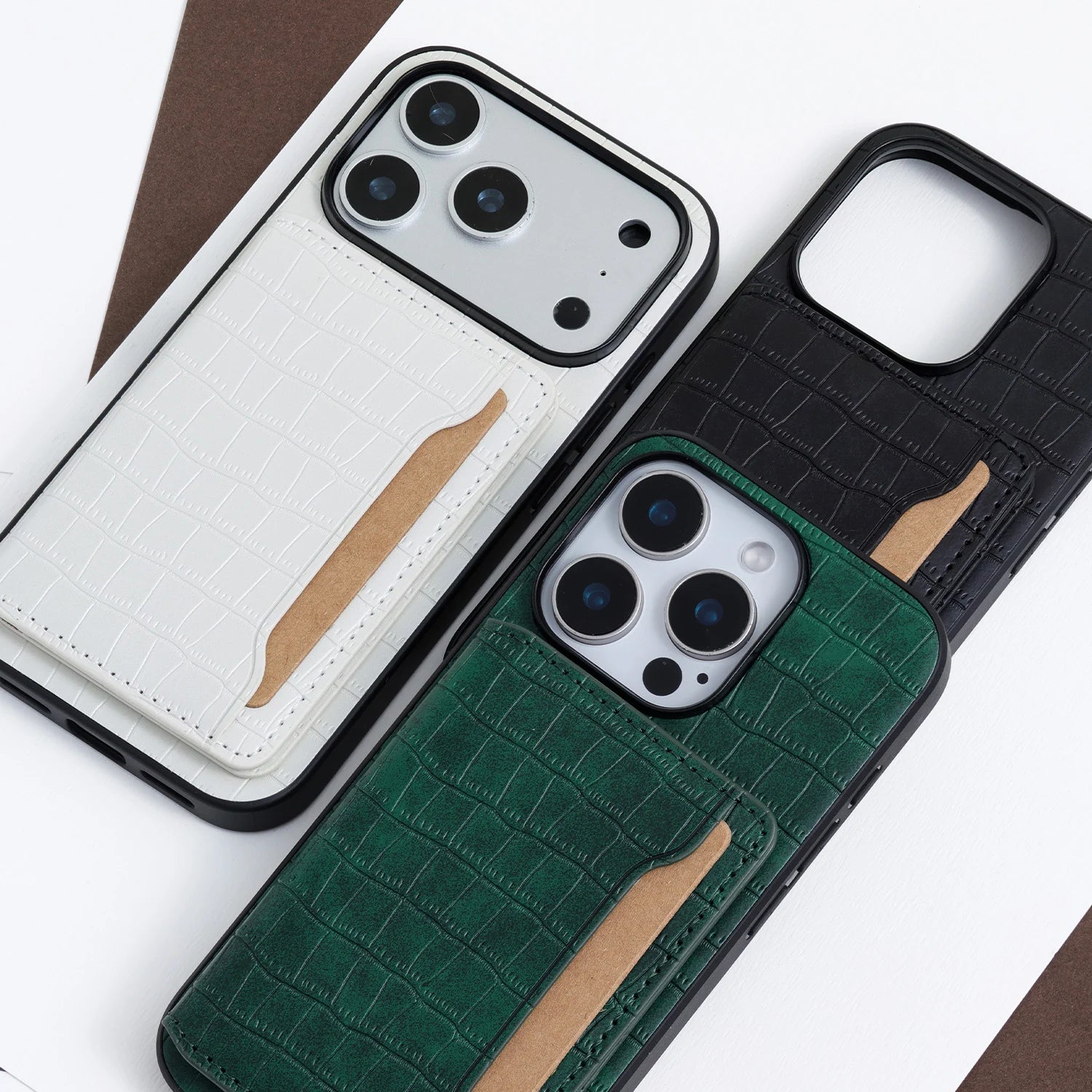 Side angled view of the green crocodile-embossed phone case showing the folded card pocket and slim profile.
