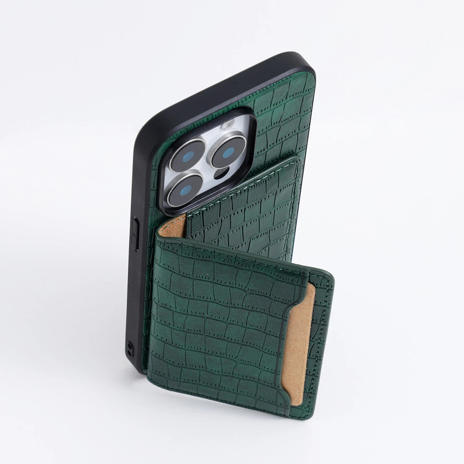 White crocodile-embossed phone case with the back wallet panel folded out to form a viewing stand.