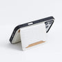Black crocodile-embossed phone case with the card pocket panel opened to reveal the inner wallet-style construction.