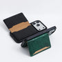 Phone case with green and brown crocodile pattern on a white background