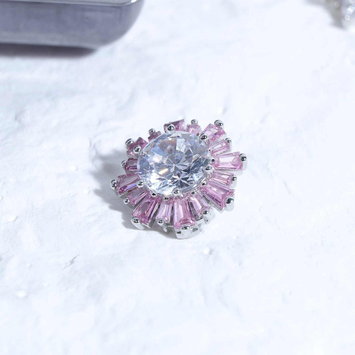 Close-up of Interstella Crystal Aura Bluetooth ear jewelry showing interchangeable crystal accessories and magnetic attachment