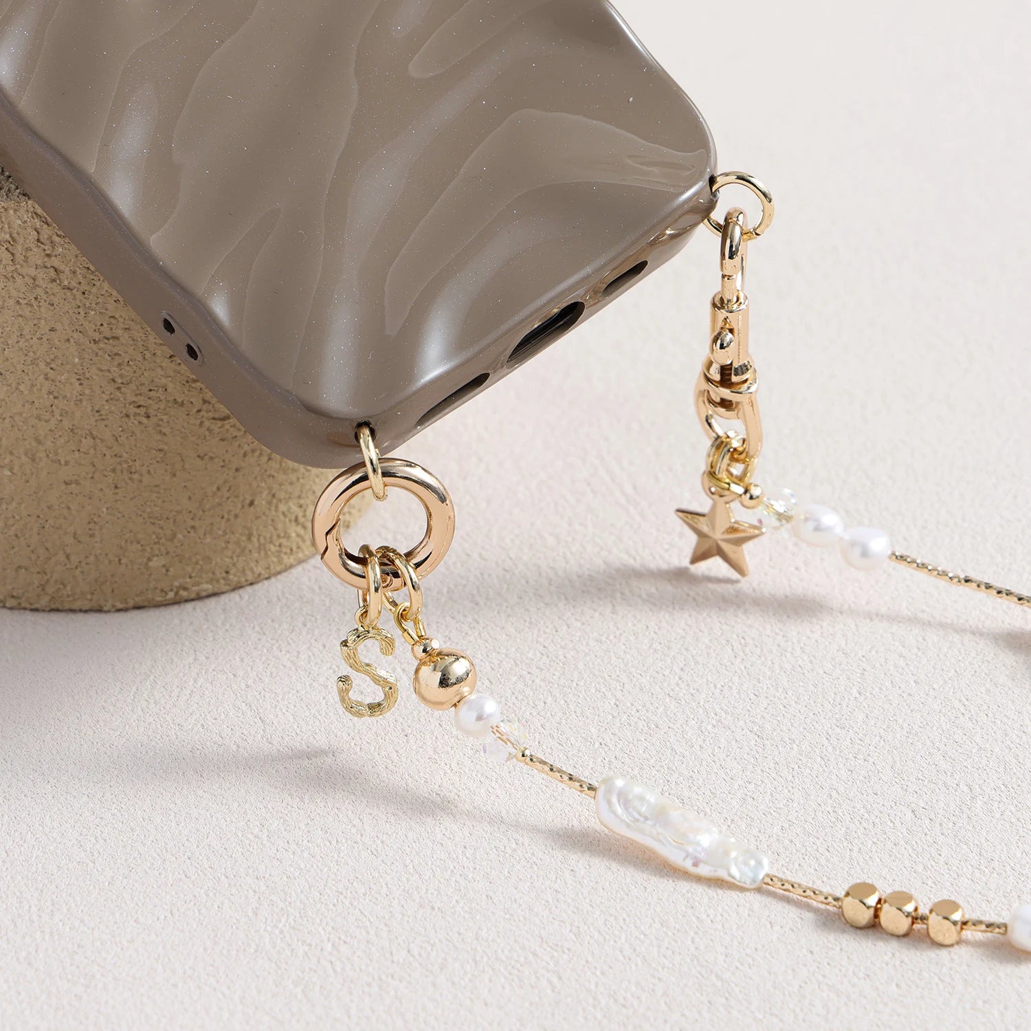 Pearl and white quartz phone strap with gold star charm