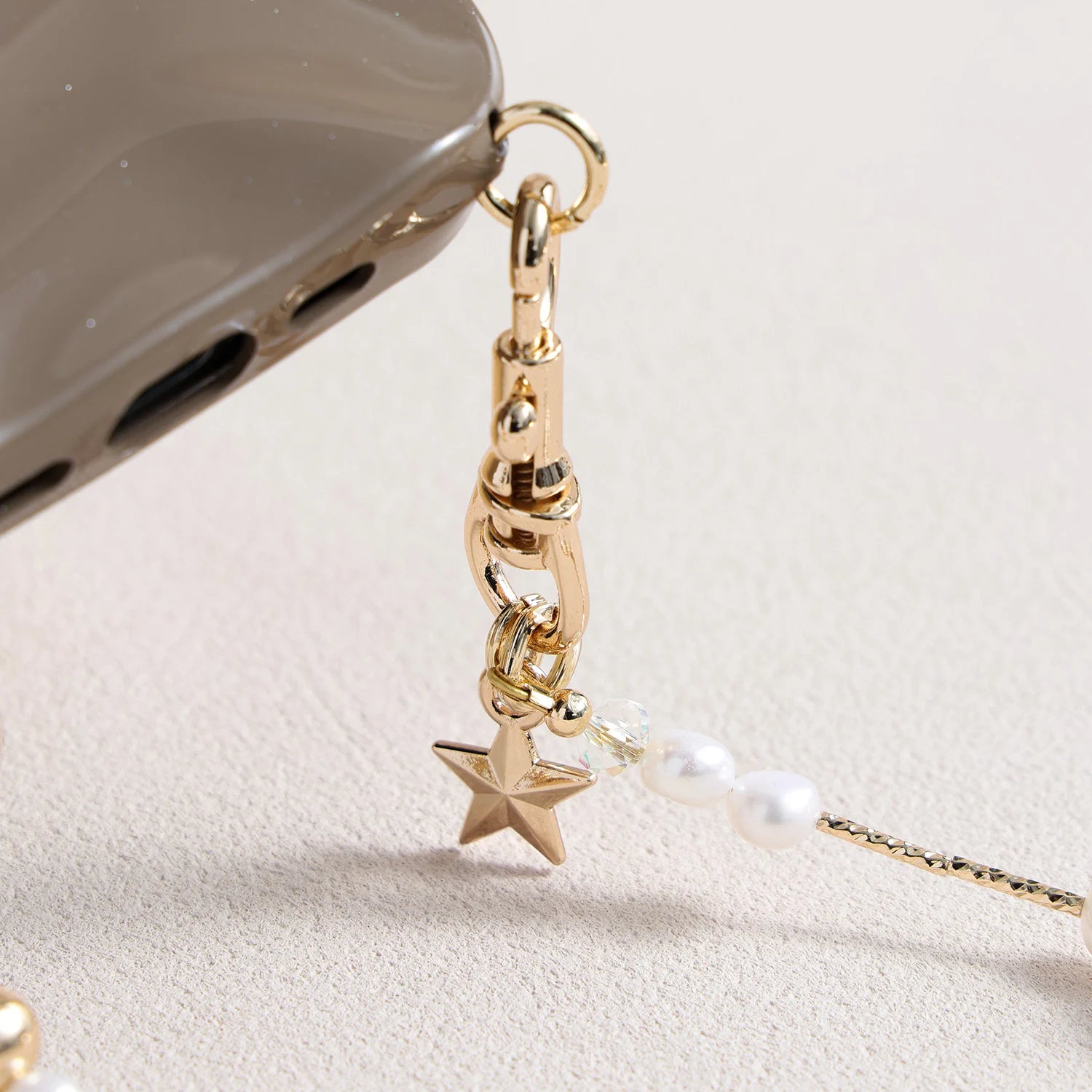 Pearl and white quartz phone strap with gold star charm