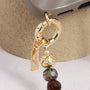Gold-tone gemstone and pearl iPhone strap with mixed crystals 