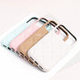 Four quilted leather phone cases in sky blue, powder pink, sand beige, and ivory arranged in a layered stack.
