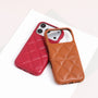 Scarlet red quilted leather phone case on a phone beside a caramel tan case shell.