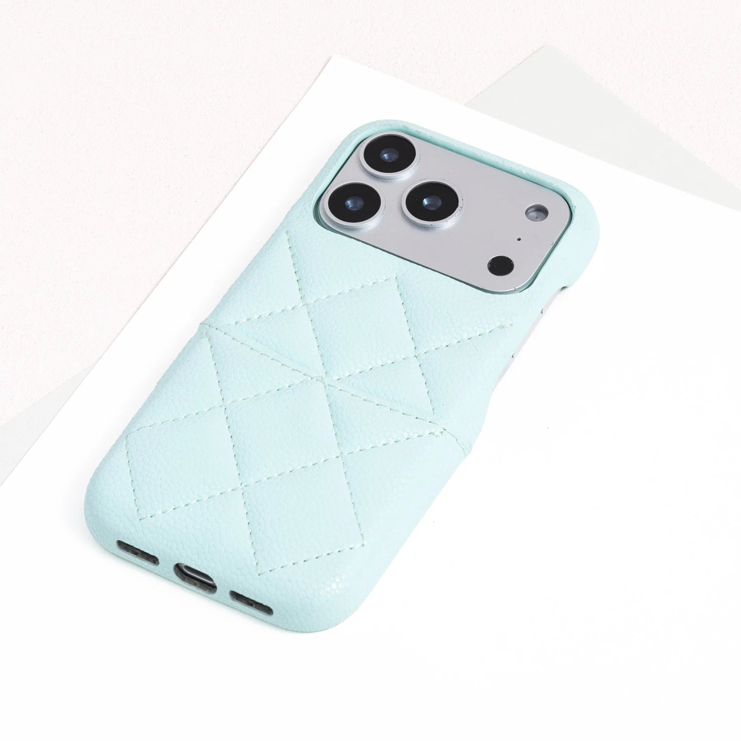 Single sky blue quilted leather phone case with refined stitched panel design.