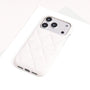 Single ivory quilted leather phone case with minimalist textured finish.