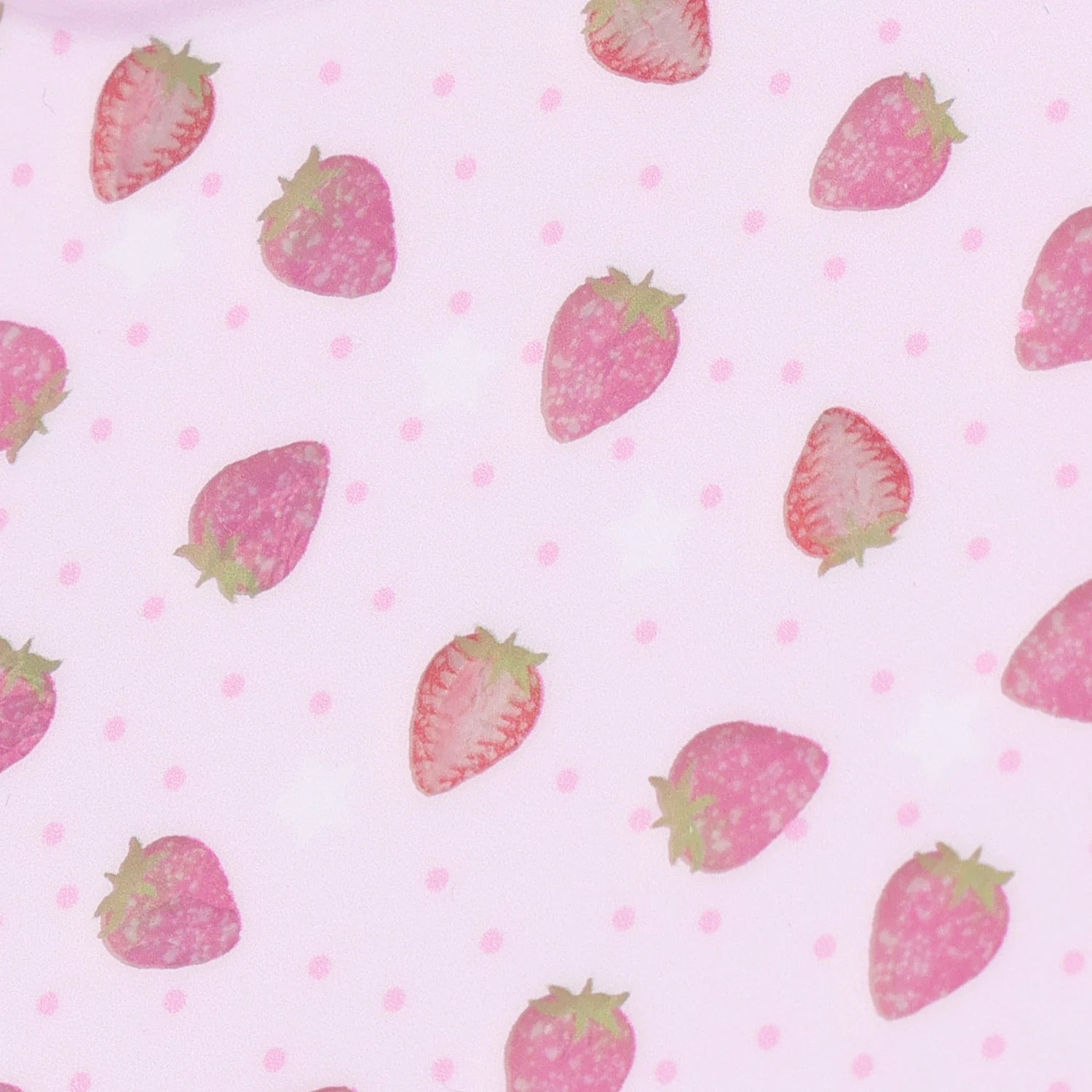 Detailed view of the strawberry print on a blush-pink TPU phone case, showing delicate fruit illustrations and soft pink dotted patterning.