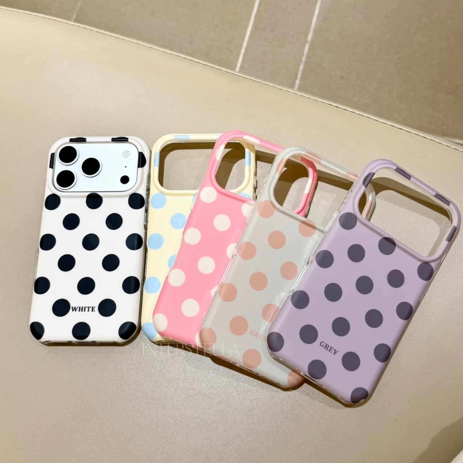 Five polka dot phone case colorways displayed together: ivory black dot, butter yellow blue dot, candy pink ivory dot, mint beige dot, and lilac grey dot.