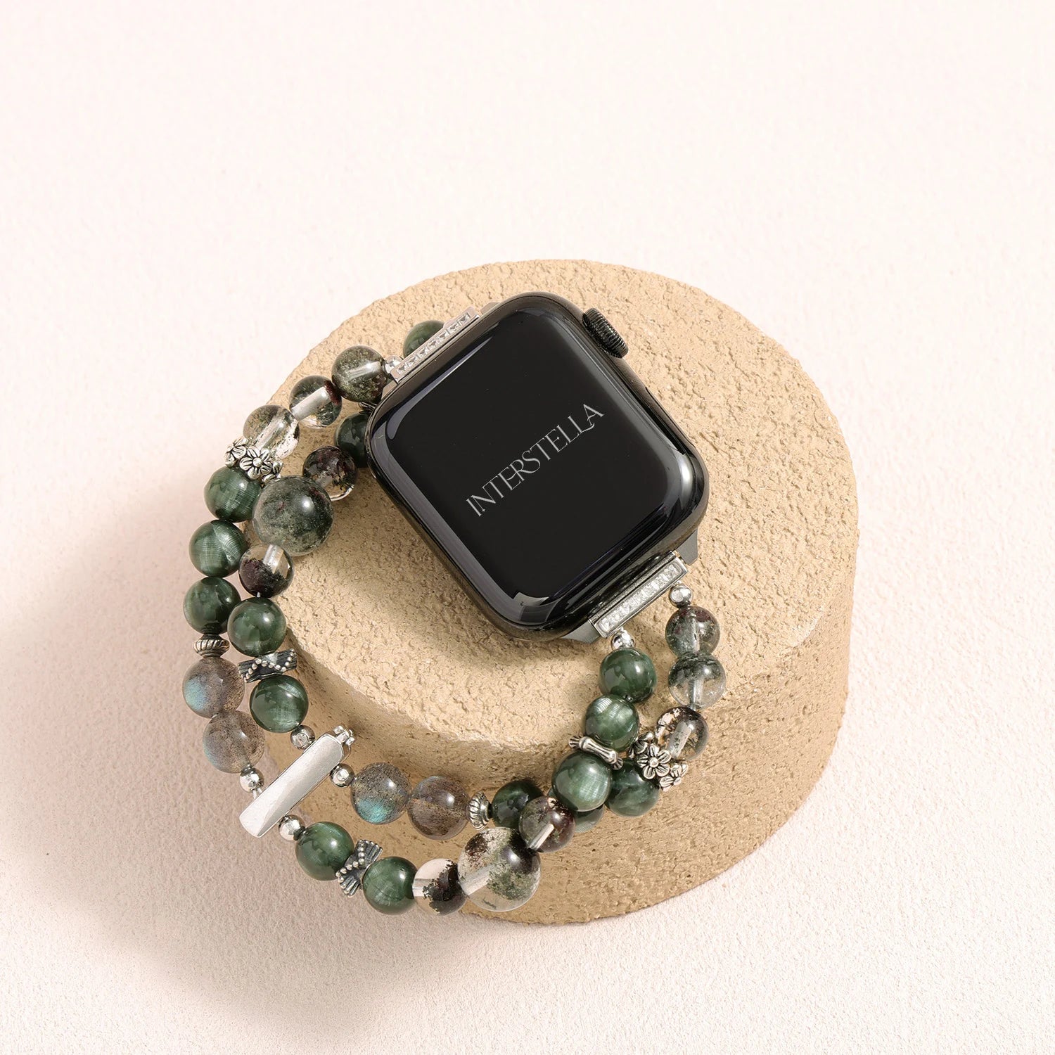 Apple Watch band made of dragon vein agate, grey moonstone, and green phantom quartz with organic layered textures