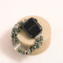 Apple Watch band made of dragon vein agate, grey moonstone, and green phantom quartz with organic layered textures
