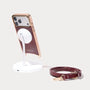 MagSafe-compatible Asteria Portico iPhone case shown on magnetic charging stand