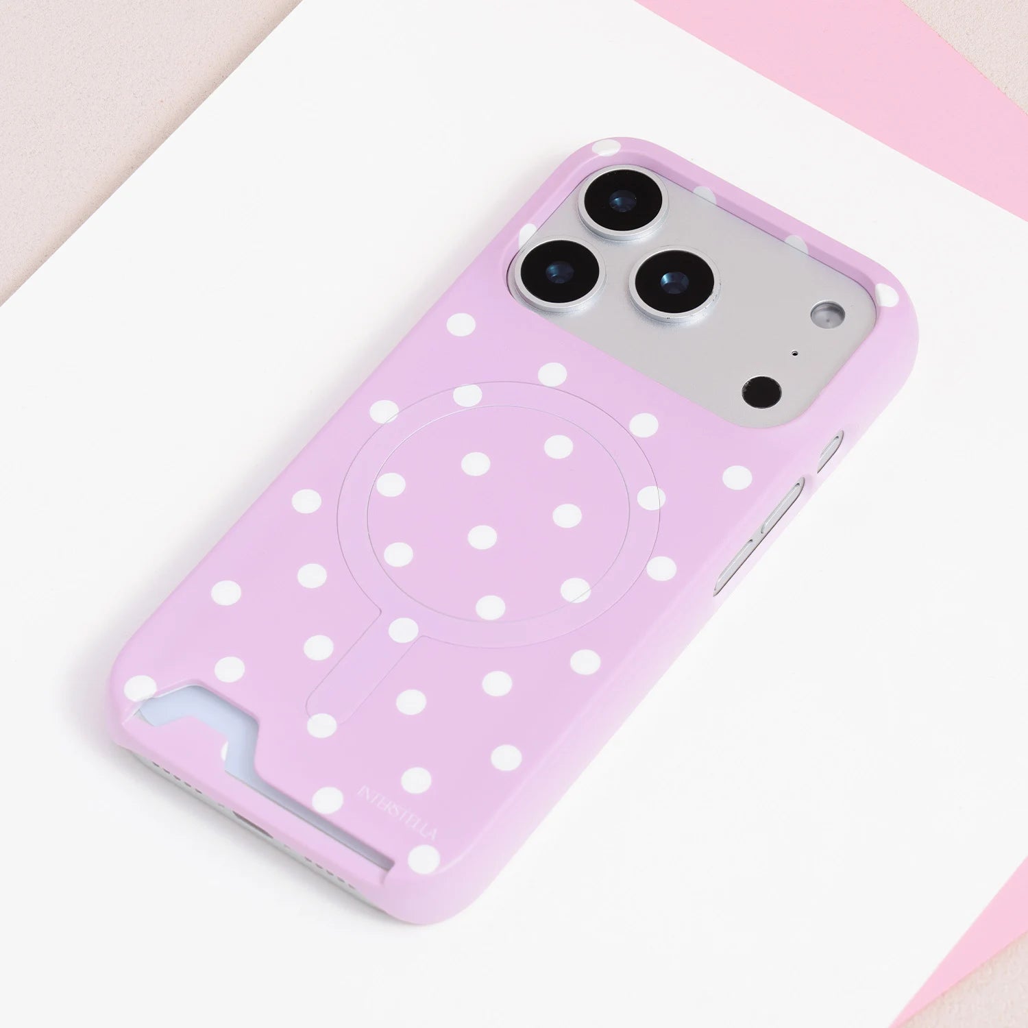Blush pink oversized polka dot card phone case in PC with built-in card slot and soft pastel finish.