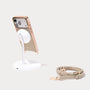 MagSafe-compatible Asteria Portico iPhone case shown on magnetic charging stand