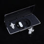 Silver-tone crystal cross ear charms displayed with black Interstella magnetic earphone charging case