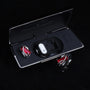 Red gemstone ear charms displayed with black Interstella magnetic earphone charging case
