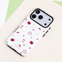 White dual-layer film-style phone case with red apple motifs, apple slices, and multicolored stars, finished with a contrasting black camera surround.