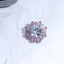 Pink crystal radial ear charm inspired by Astraea with round center stone and baguette-cut halo