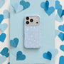 Baby blue matte star phone case with white star print on a blue heart backdrop