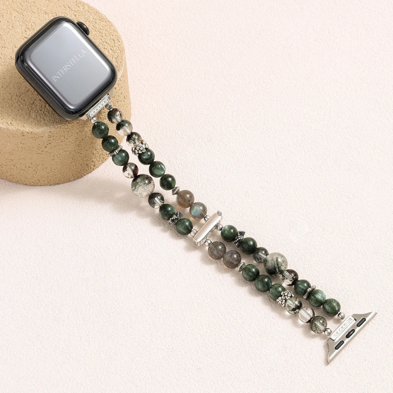 Apple Watch band made of dragon vein agate, grey moonstone, and green phantom quartz with organic layered textures