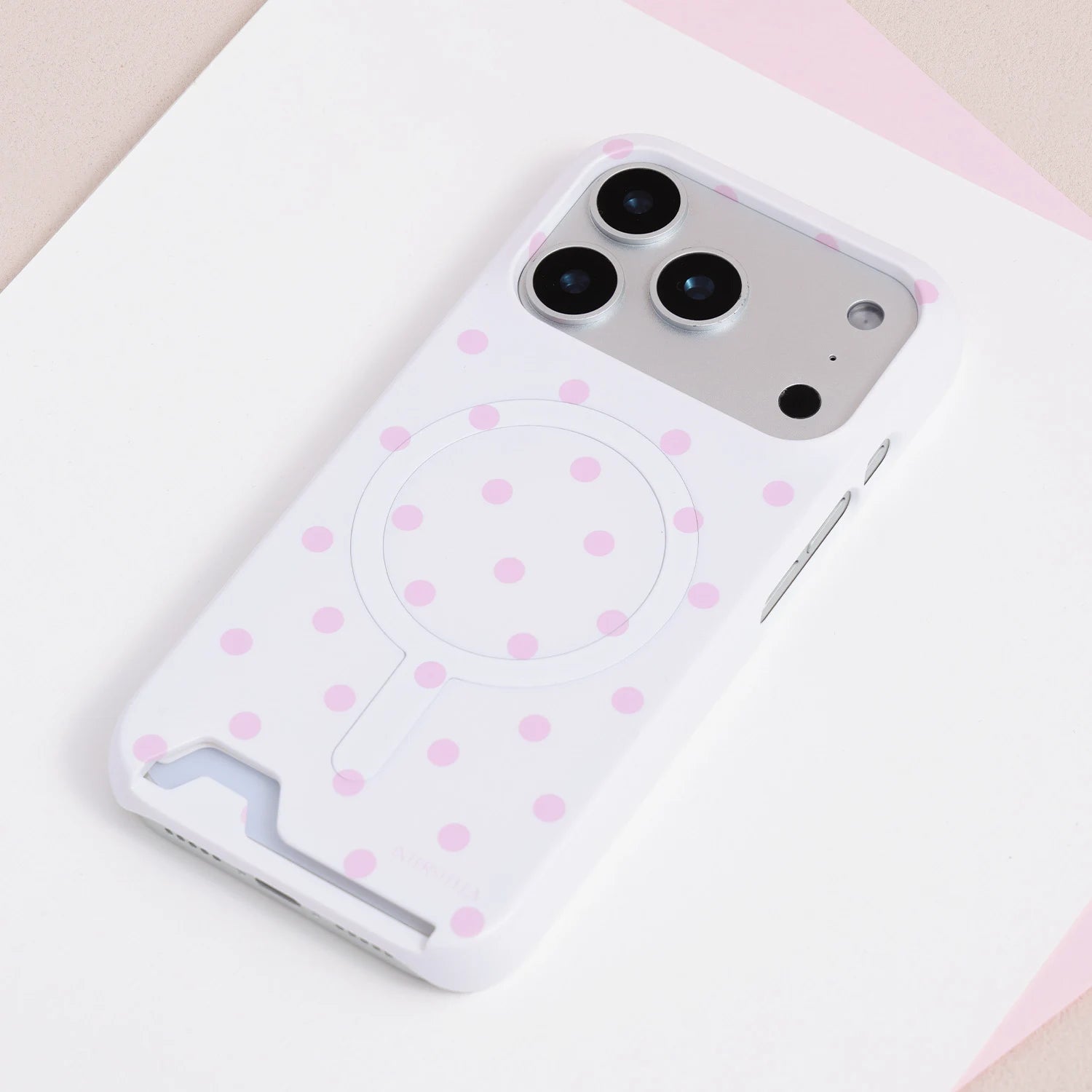 Porcelain white oversized polka dot card phone case with blush-pink dots and integrated card insert design.