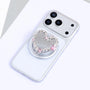 Heart-shaped silver-tone mirror phone stand with blush pink crystal accents attached to a silver phone on a circular stand base.