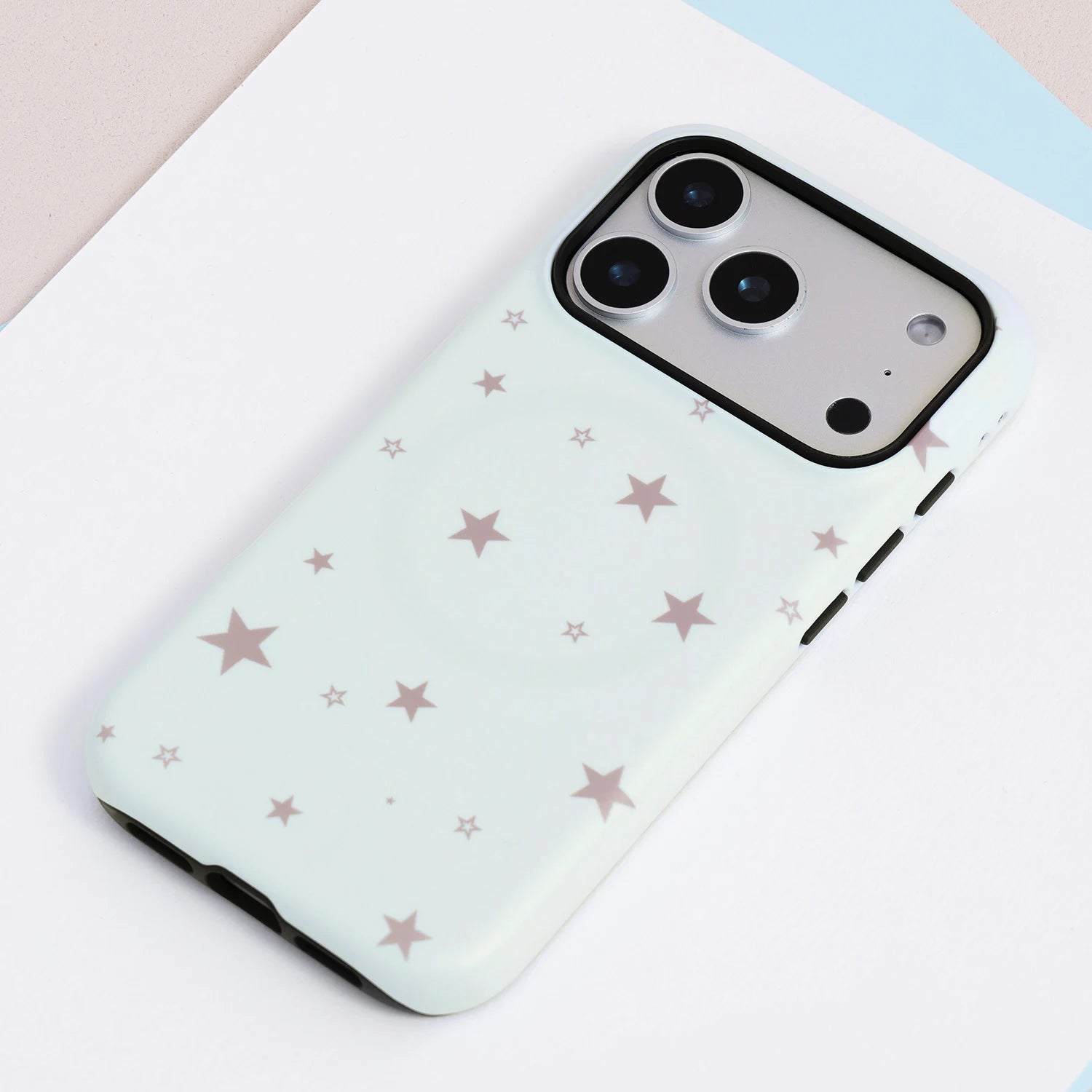 Mint star print phone case with matching star-shaped grip, featuring a frosted hard-shell exterior and soft silicone inner construction.