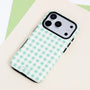Mint gingham dual-layer phone case with a pastel green and white check pattern, black side buttons, and raised black camera frame.