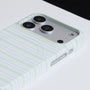 Close-up of mint striped phone case showing raised camera surround and striped hard-shell finish