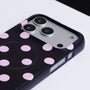 Close-up of Interstella polka dot phone case showing raised camera surround and side button cutouts