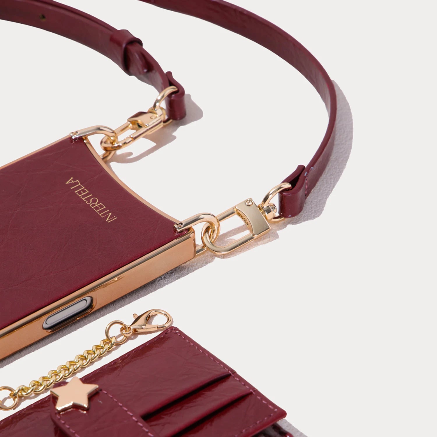 Close-up of detachable strap hardware on Asteria Portico convertible iPhone case