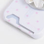Close-up of the white star print card phone case bottom section showing the card slot opening and blush-pink stars.