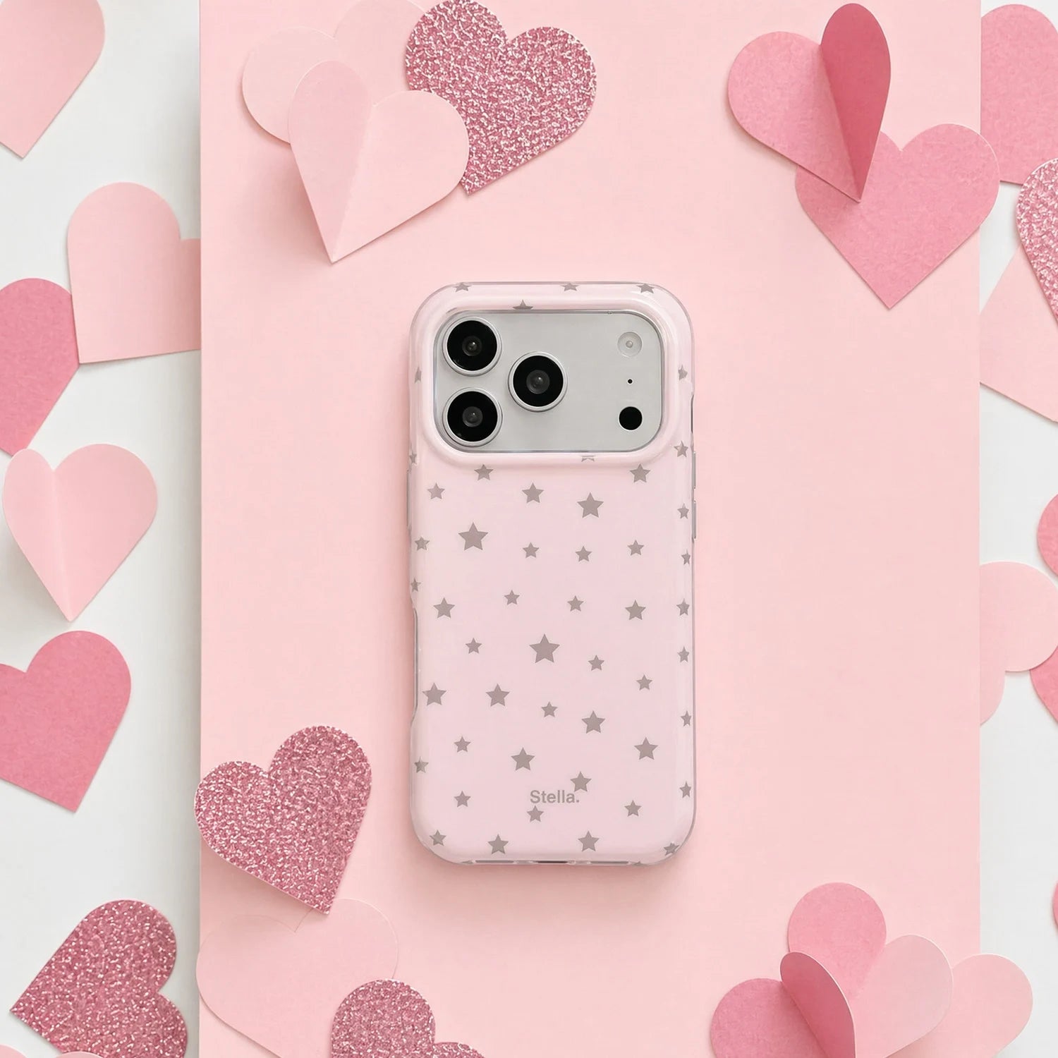 Blush pink matte star phone case with silver star print on a pink heart backdrop