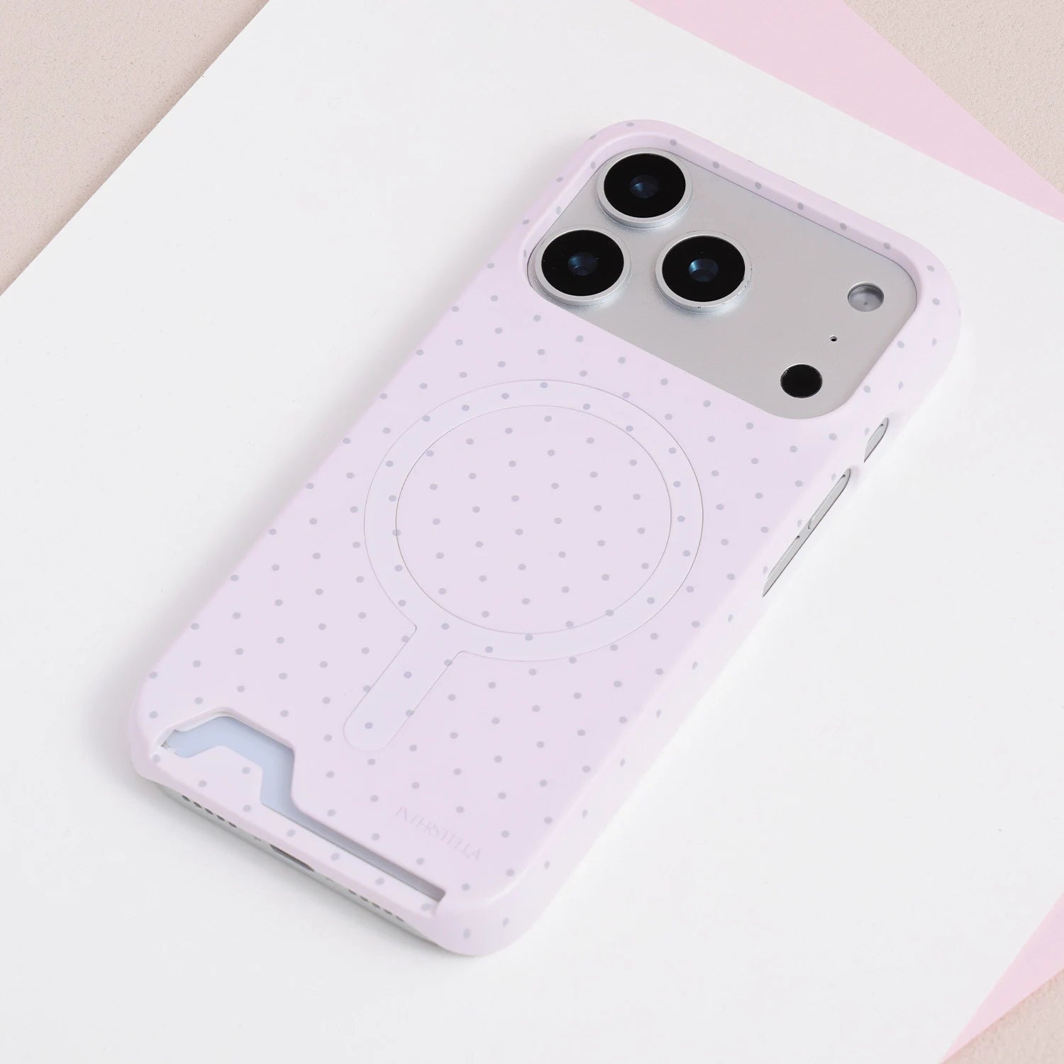 Full view of the blush pink polka dot card phone case with pastel finish and clean structured silhouette.