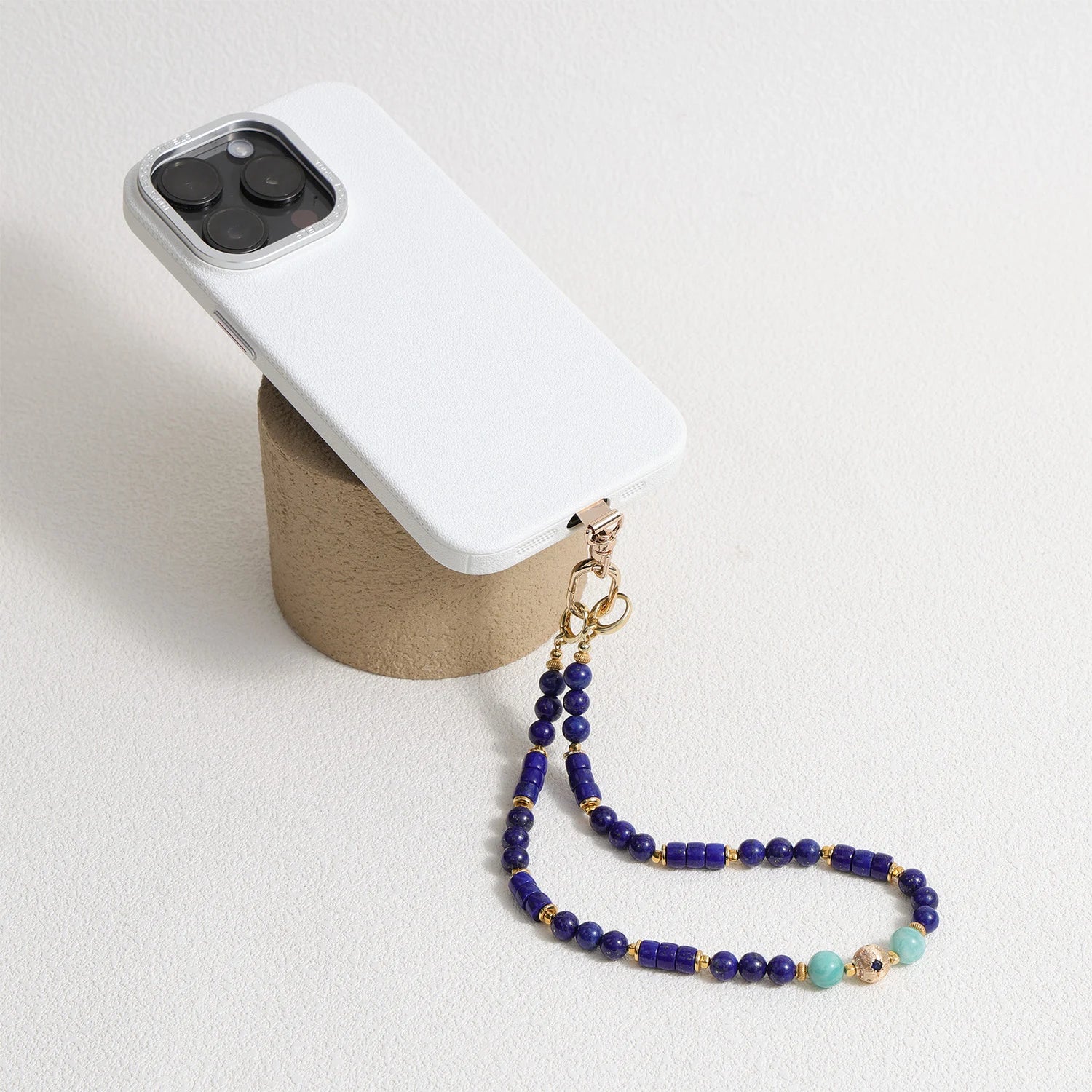 Lapis Lazuli and Amazonite gemstone phone strap with gold metal details, detachable bracelet design