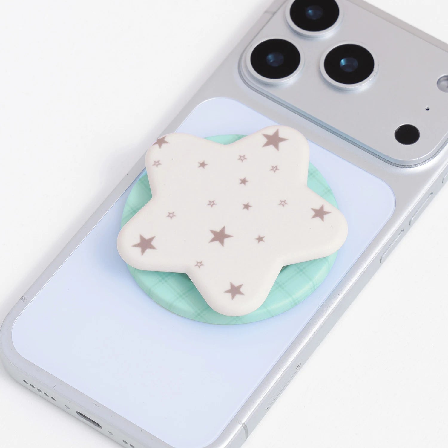 Matching phone case and star grip set displayed separately, showing the frosted case finish, soft inner lining, and coordinating star-shaped holder.