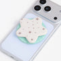 Matching phone case and star grip set displayed separately, showing the frosted case finish, soft inner lining, and coordinating star-shaped holder.