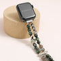 Apple Watch band made of dragon vein agate, grey moonstone, and green phantom quartz with organic layered textures