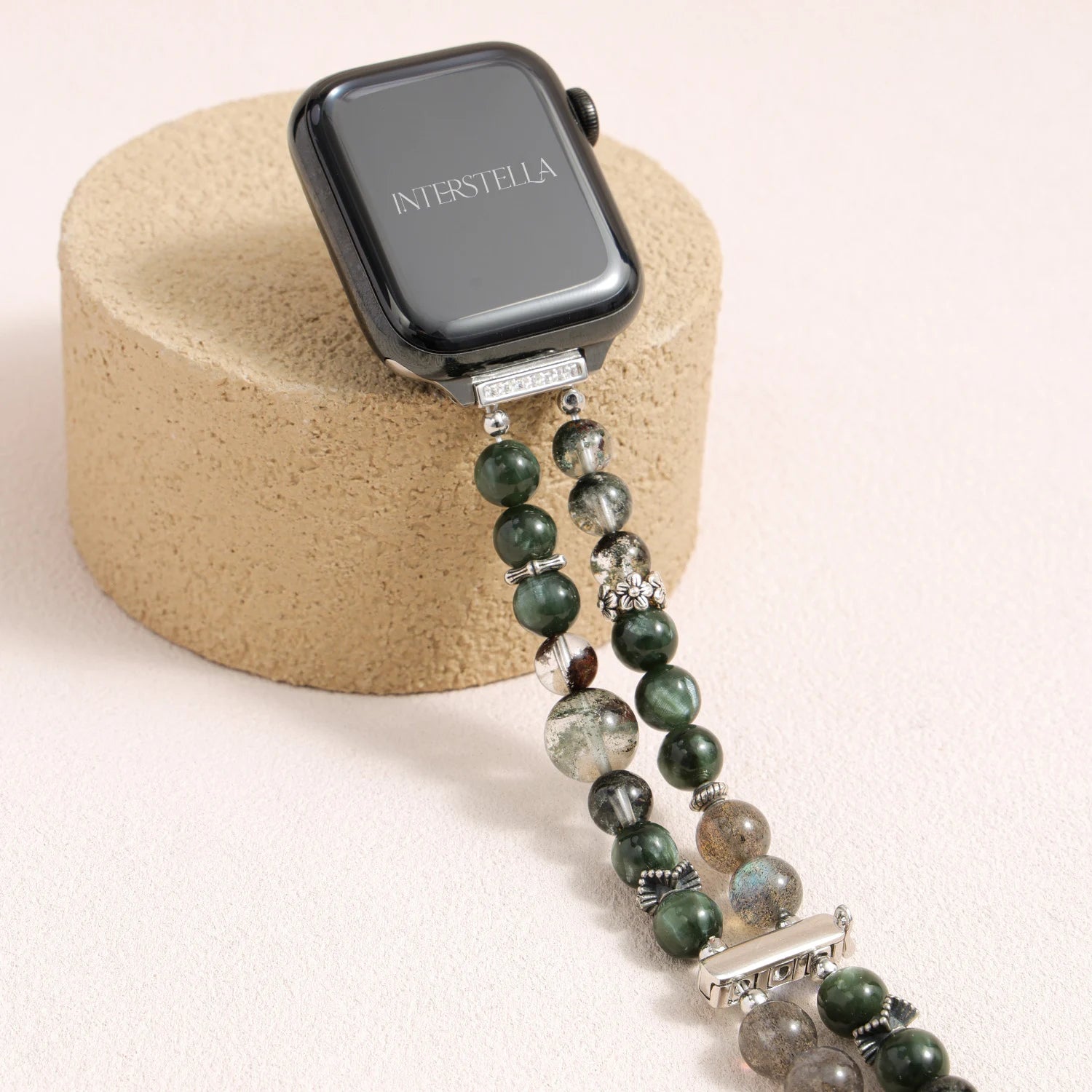 Apple Watch band made of dragon vein agate, grey moonstone, and green phantom quartz with organic layered textures