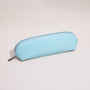 Close-up of the croc-embossed leather texture and silver-tone zipper on a slim pencil case