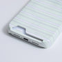 Close-up of mint striped card slot phone case showing bottom card opening and charging port cutout