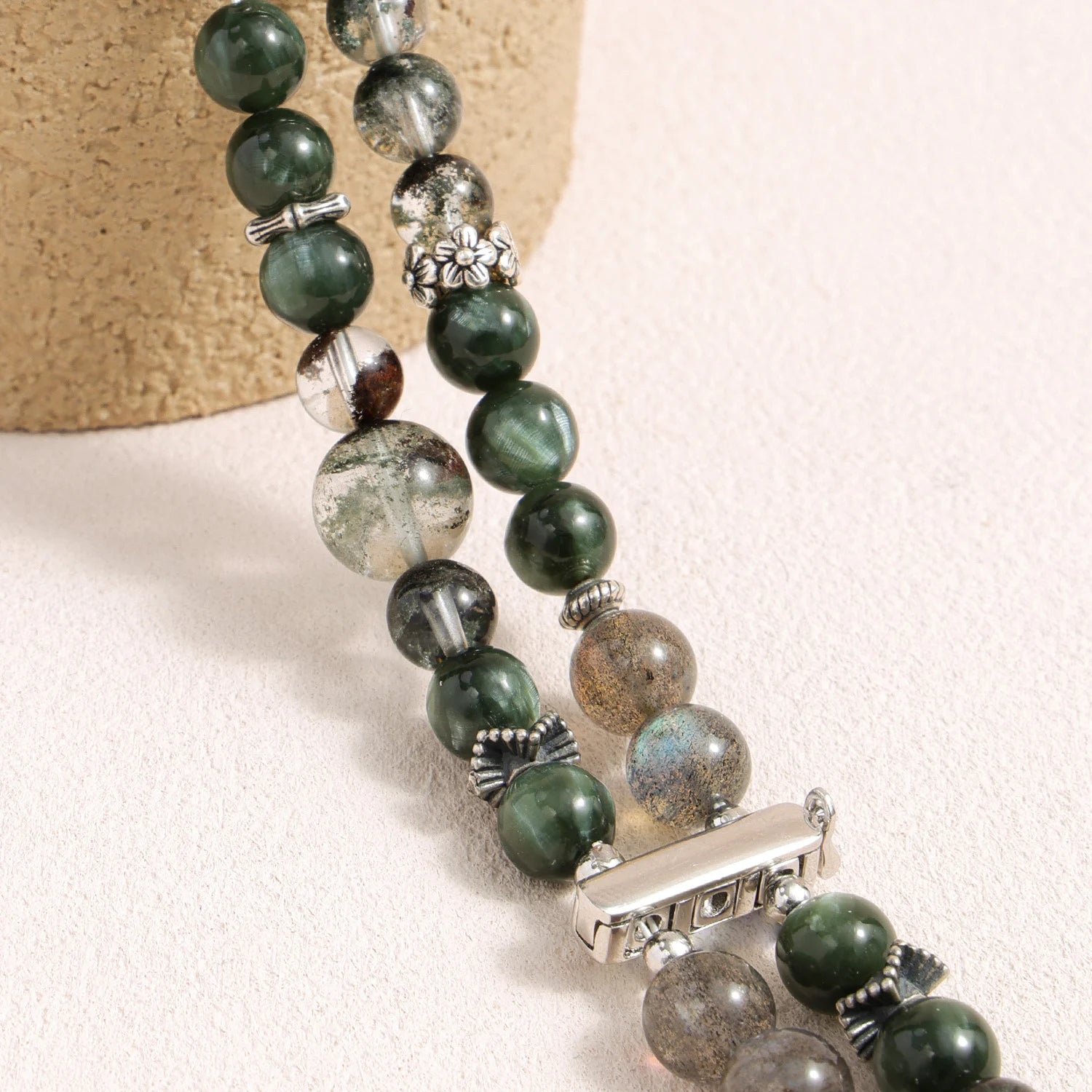 Apple Watch band made of dragon vein agate, grey moonstone, and green phantom quartz with organic layered textures