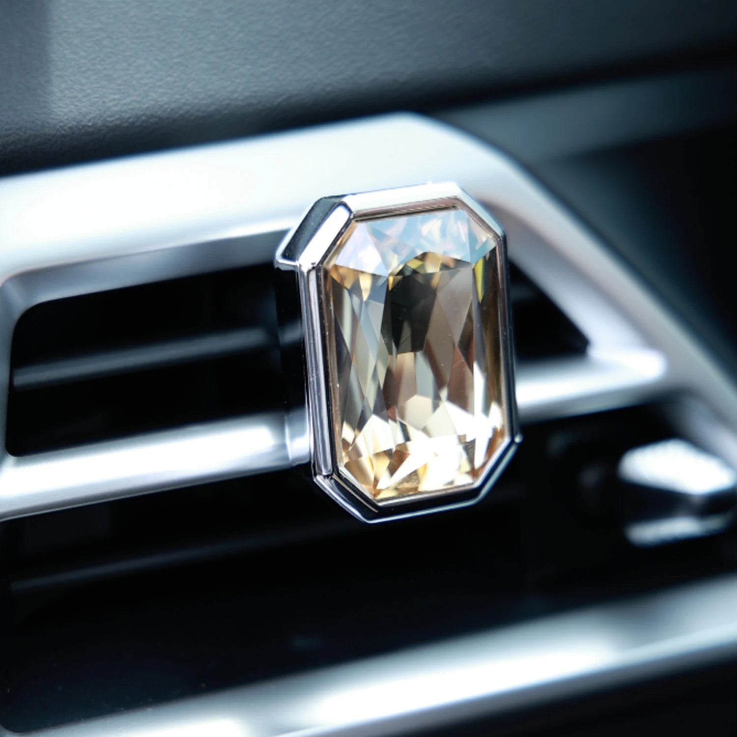 Luxury crystal car Fragrance clipped onto a car air vent with brilliant prism reflections