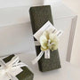 Ombre Orchidée botanical gift wrapping style with orchid embellishment, dark floral paper, and elegant ribbon detail