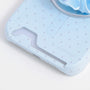 Close-up of the powder blue polka dot phone case bottom section, highlighting the built-in card insert slot.