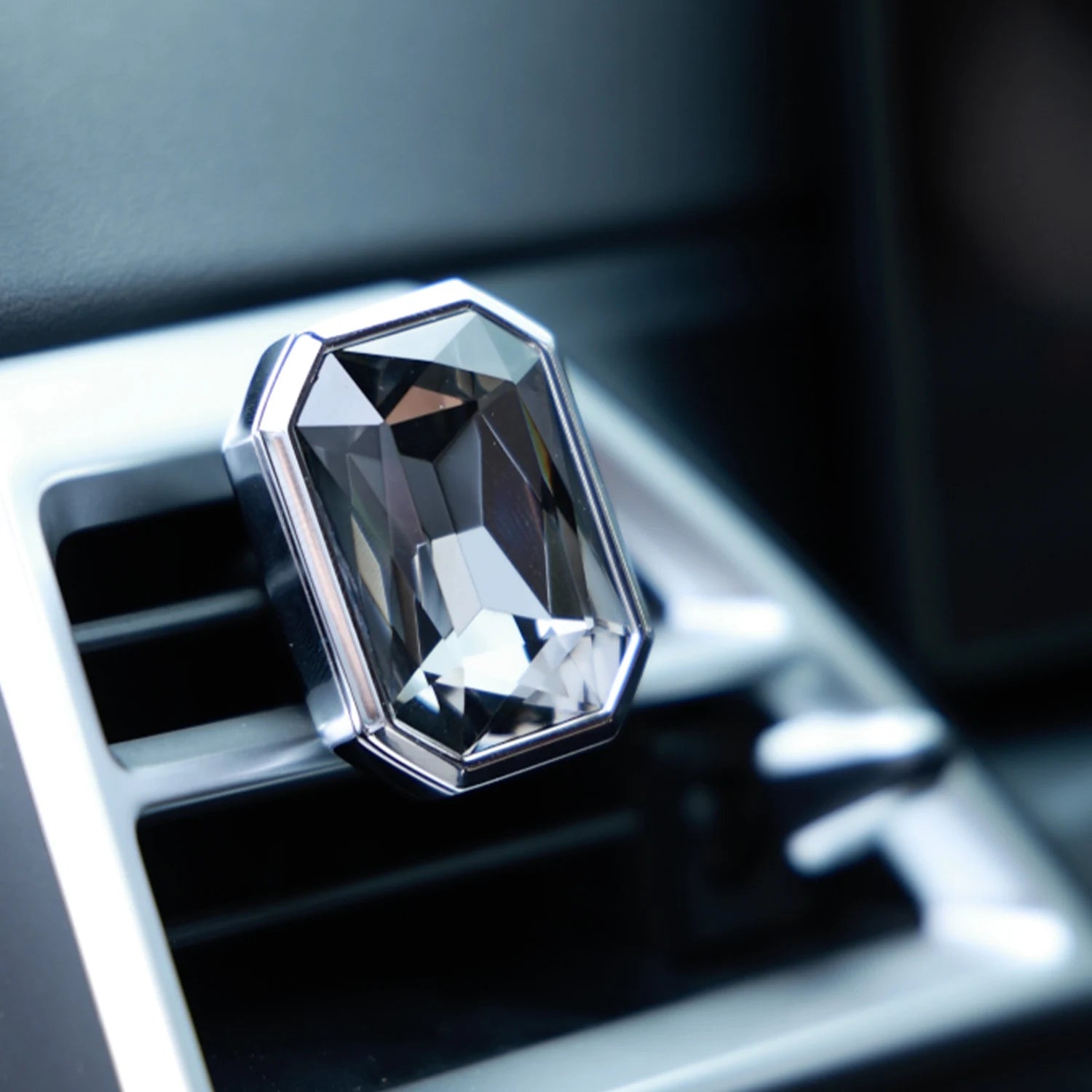 Luxury crystal car Fragrance clipped onto a car air vent with brilliant prism reflections