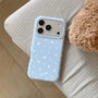Baby blue matte star phone case with white star print resting on a sofa
